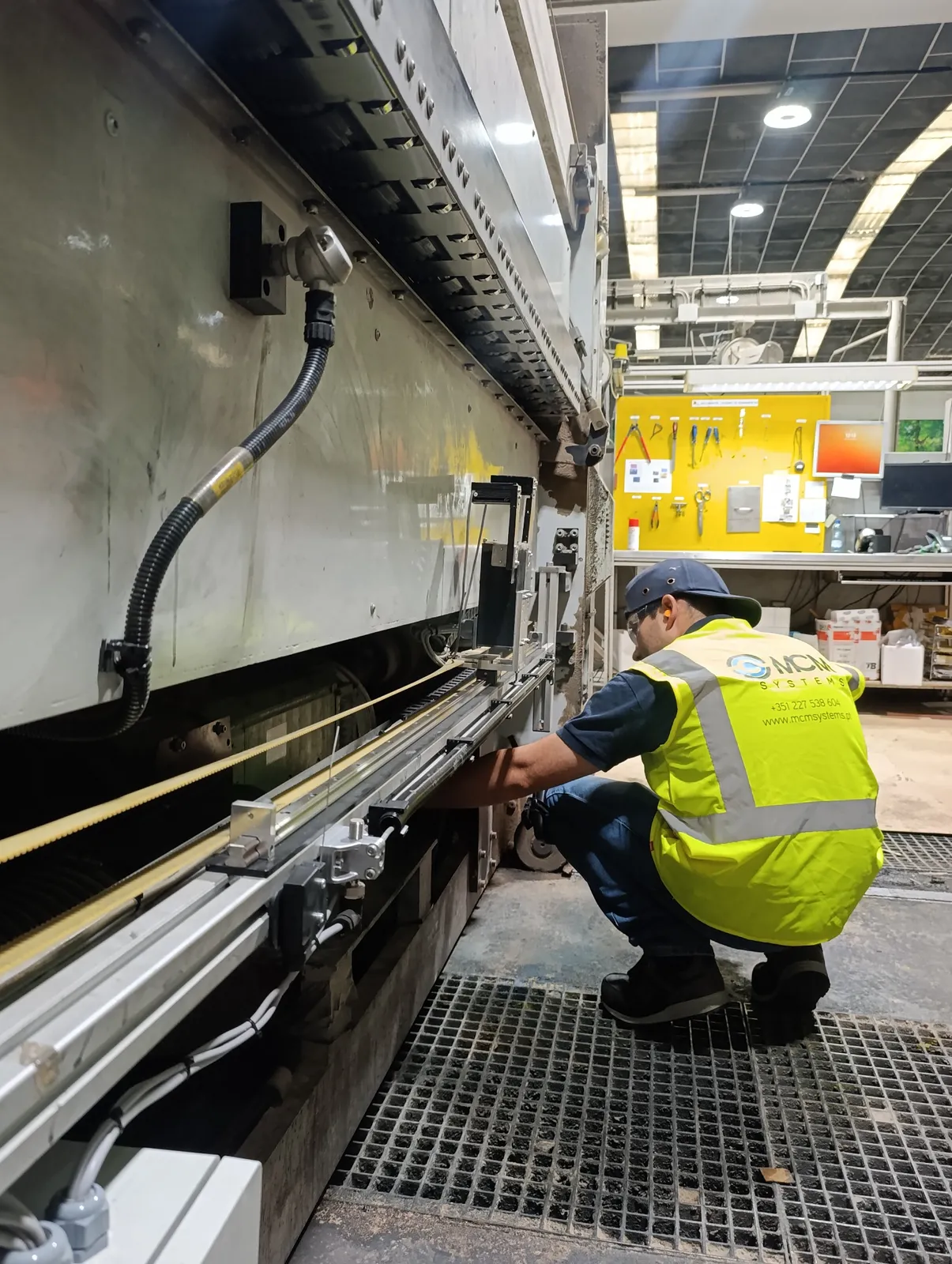 MCM engineer installing and commissioning a custom industrial inspection system on customer equipment