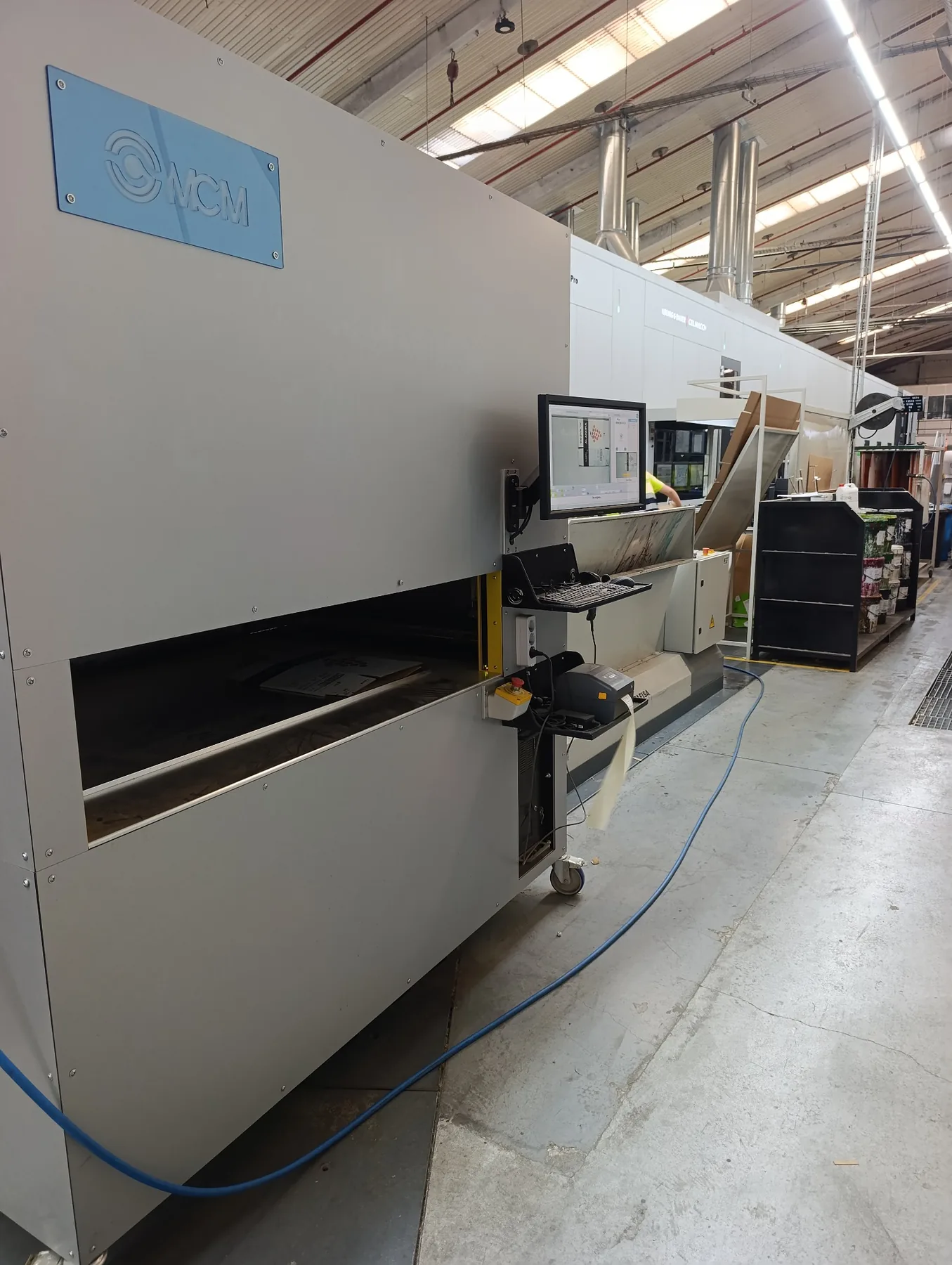 MCM packaging inspection equipment installed in a corrugated packaging production environment