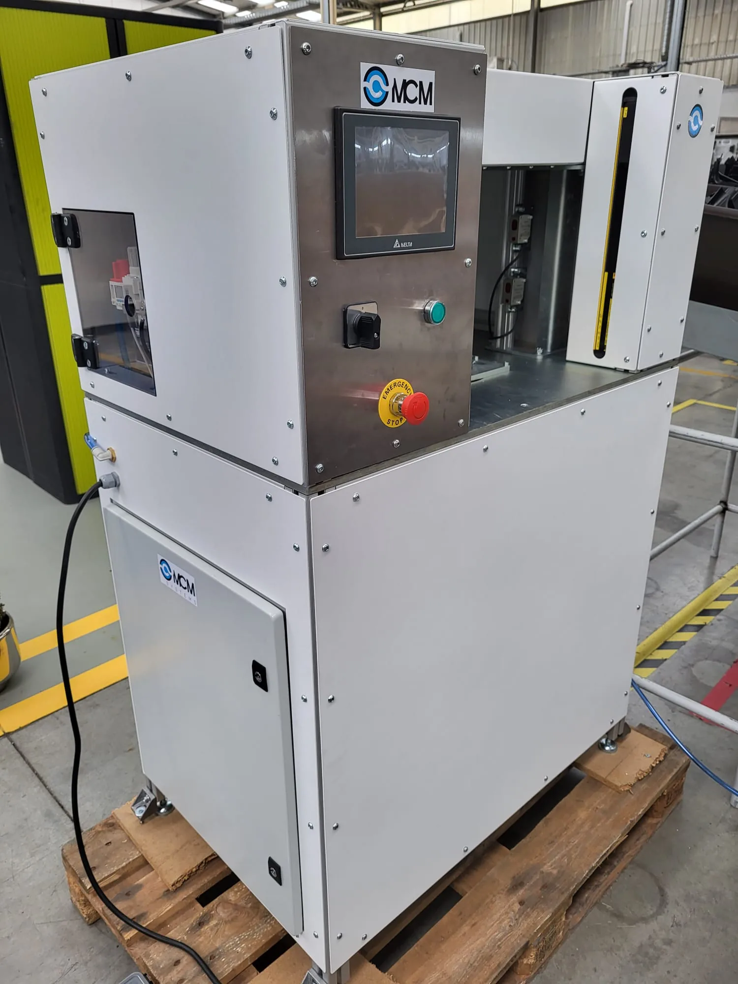 Complete MCM industrial test station with enclosed mechanics and operator controls